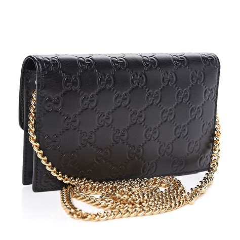 gucci black perforated leather web chain wallet|Gucci guccissima wallet on chain.